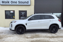 White 2020 Mitsubishi RVR with black wheels and dark privacy tint